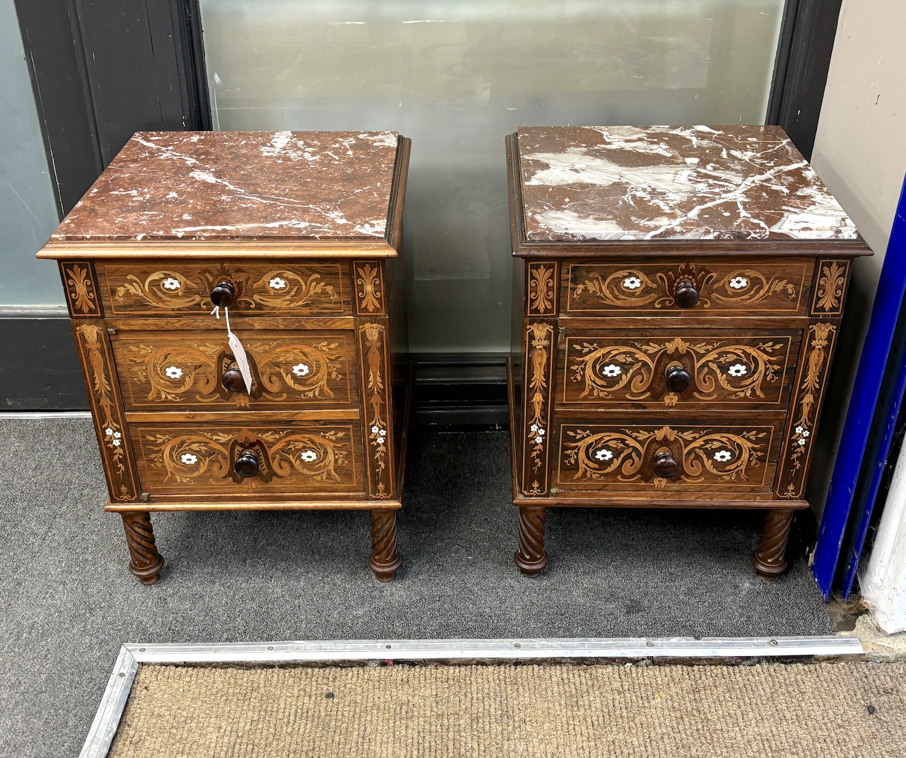 A pair of late 19th century French marquetry inlaid rosewood three drawer marble topped bedside chests, width 39cm, depth 38cm, height 53cm